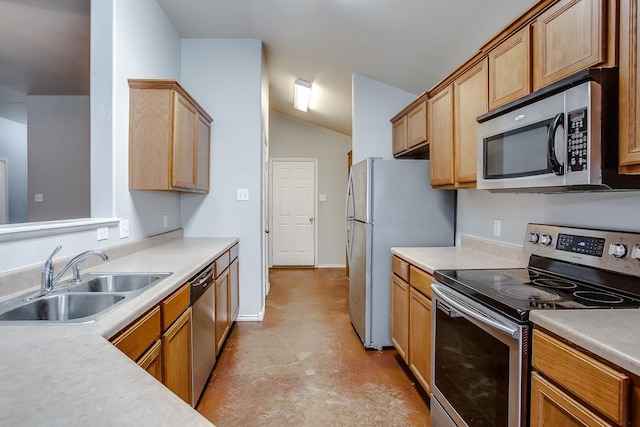 kitchen featuring sink, vaulted ceiling, and appliances with stainless steel finishes