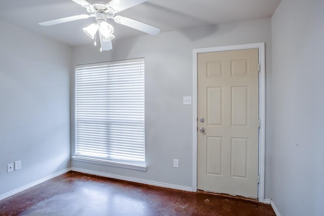 entrance foyer with ceiling fan