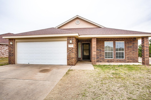 ranch-style house featuring a garage and a front lawn