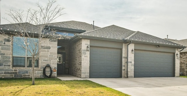 view of front facade with a garage and a front lawn