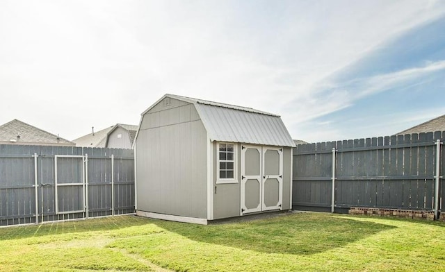 view of outbuilding featuring a lawn