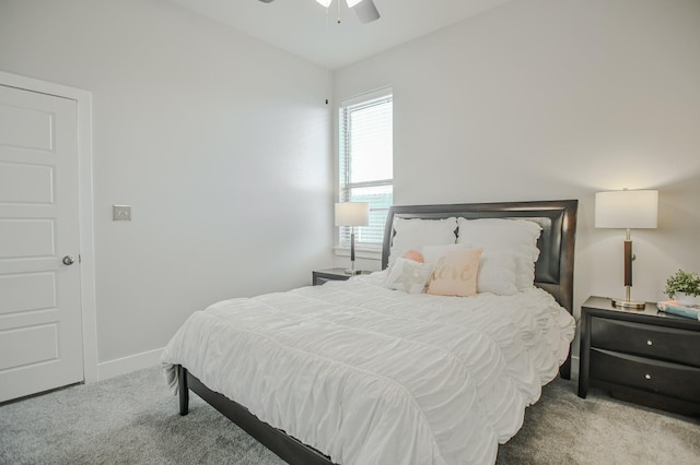 carpeted bedroom with ceiling fan and lofted ceiling