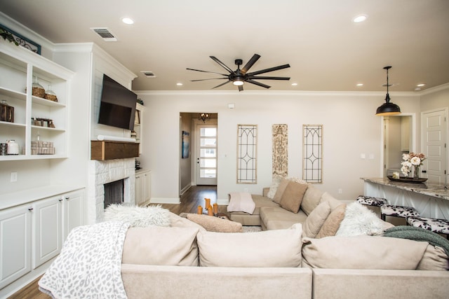 living area featuring visible vents, ceiling fan, recessed lighting, and dark wood-style floors