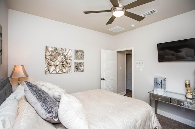 carpeted bedroom with visible vents and ceiling fan