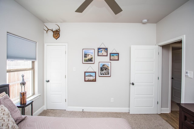 bedroom featuring ceiling fan, carpet floors, and baseboards
