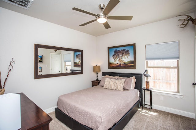 bedroom featuring carpet, visible vents, and baseboards