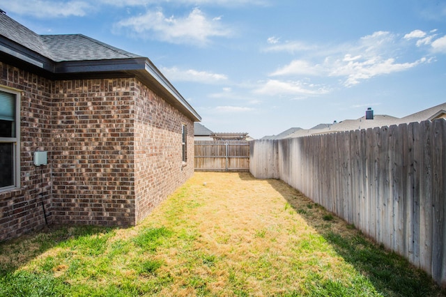 view of yard featuring a fenced backyard