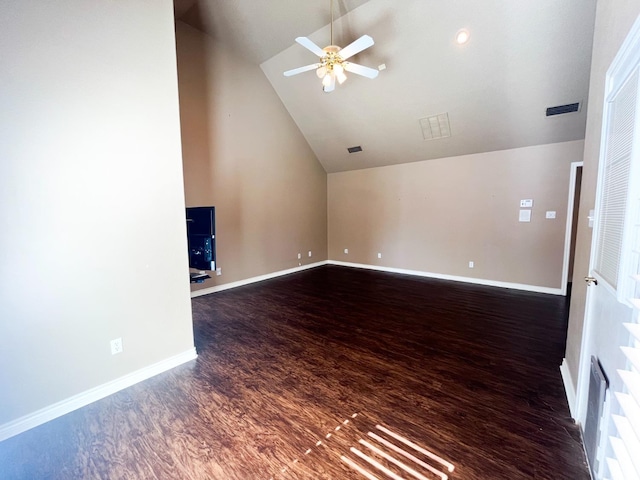 unfurnished living room with dark hardwood / wood-style flooring, lofted ceiling, and ceiling fan