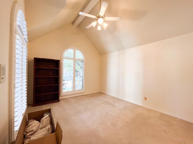 additional living space featuring lofted ceiling with beams, light colored carpet, and ceiling fan