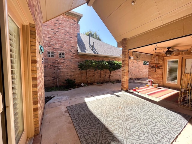 view of patio / terrace featuring ceiling fan