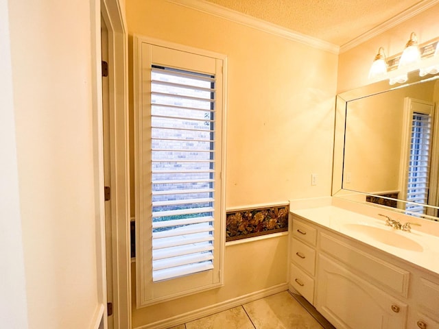 bathroom with vanity, crown molding, tile patterned floors, and a textured ceiling