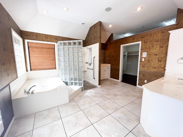 bathroom with vanity, tile patterned flooring, lofted ceiling, and independent shower and bath