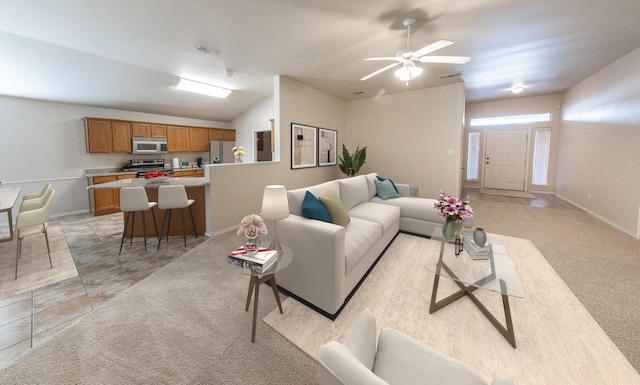 living room featuring lofted ceiling, light colored carpet, and ceiling fan