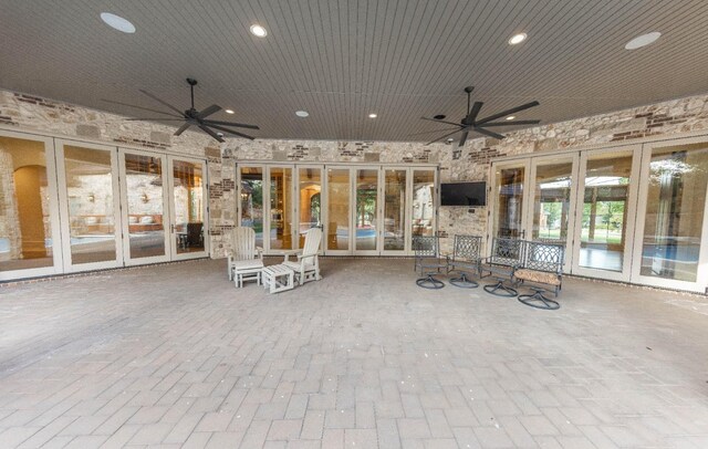 view of patio / terrace featuring ceiling fan and french doors