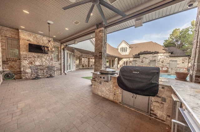 view of patio / terrace with ceiling fan and area for grilling