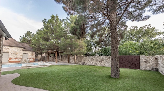 view of yard with a fenced in pool