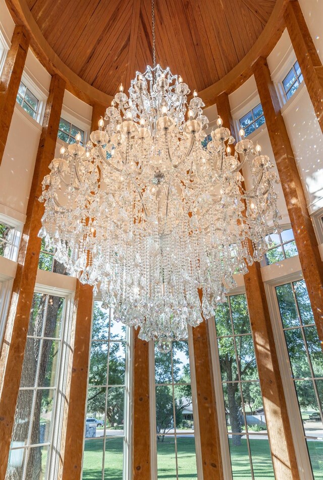 interior details featuring an inviting chandelier