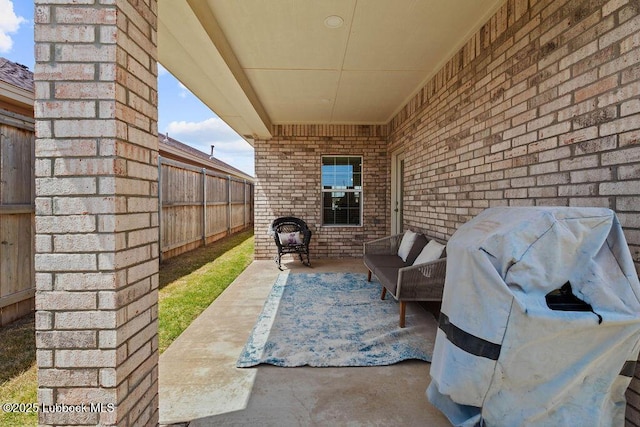 902 N Fulton Ave, Lubbock, TX 79416 - fenced backyard featuring a patio, outdoor lounge area, and a grill