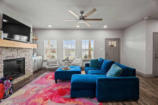902 N Fulton Ave, Lubbock, TX 79416 - living area with dark wood-type flooring, a ceiling fan, recessed lighting, baseboards, and a stone fireplace