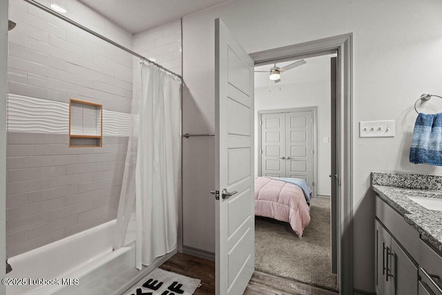 902 N Fulton Ave, Lubbock, TX 79416 - full bath featuring vanity, shower / bathtub combination with curtain, wood finished floors, and ceiling fan