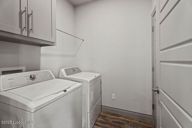 902 N Fulton Ave, Lubbock, TX 79416 - laundry area with cabinet space, washer and clothes dryer, dark wood finished floors, and baseboards