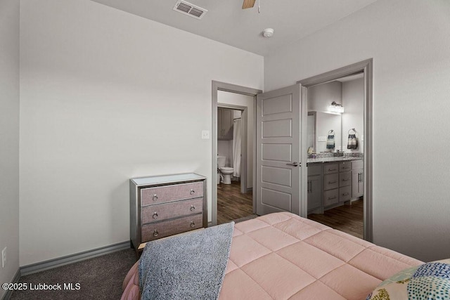 902 N Fulton Ave, Lubbock, TX 79416 - bedroom featuring connected bathroom and baseboards