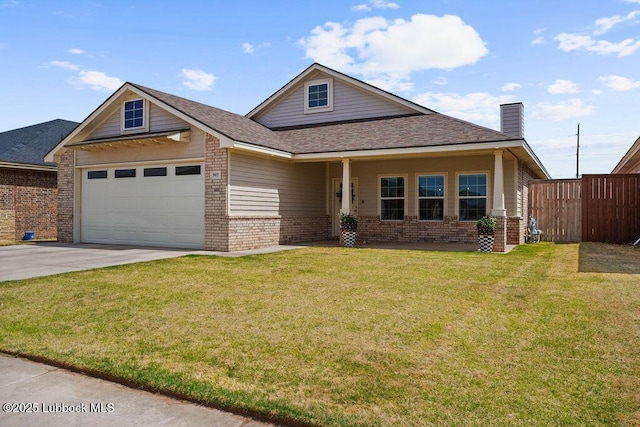 902 N Fulton Ave, Lubbock, TX 79416 - view of front facade with brick siding, an attached garage, driveway, and a chimney
