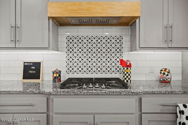 902 N Fulton Ave, Lubbock, TX 79416 - kitchen with stainless steel gas stovetop, backsplash, and light stone countertops