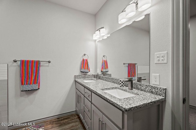902 N Fulton Ave, Lubbock, TX 79416 - full bath featuring double vanity and wood finished floors