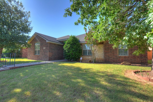 ranch-style house with a front yard