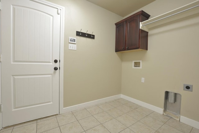 laundry area featuring cabinets, hookup for a washing machine, hookup for an electric dryer, and light tile patterned flooring