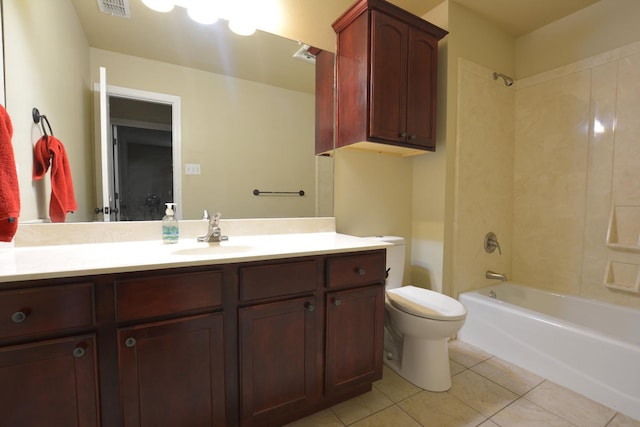 full bathroom with tiled shower / bath, tile patterned floors, toilet, and vanity