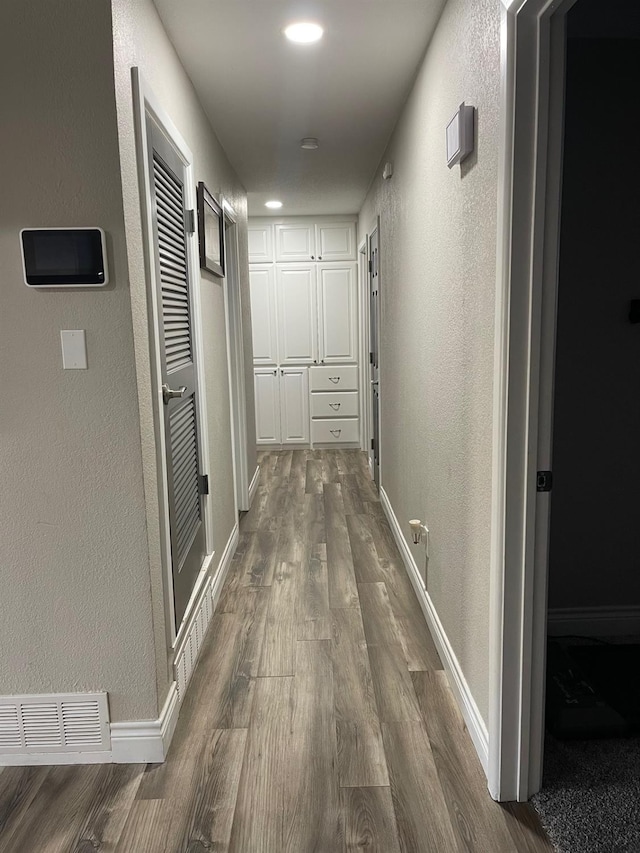 hallway featuring hardwood / wood-style flooring