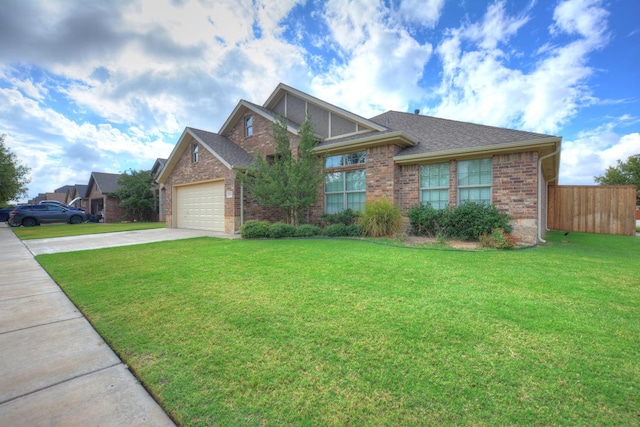 view of front of property with a garage and a front yard