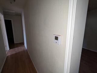 6423 22nd St, Lubbock, TX 79407 - corridor featuring dark wood finished floors