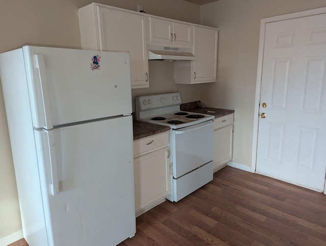 6423 22nd St, Lubbock, TX 79407 - kitchen featuring white appliances, under cabinet range hood, dark countertops, and dark wood-style floors