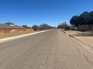 6423 22nd St, Lubbock, TX 79407 - view of asphalt street with curbs and sidewalks