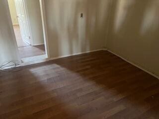 6423 22nd St, Lubbock, TX 79407 - spare room featuring wood finished floors
