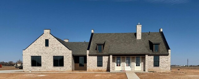 view of front of house with a chimney