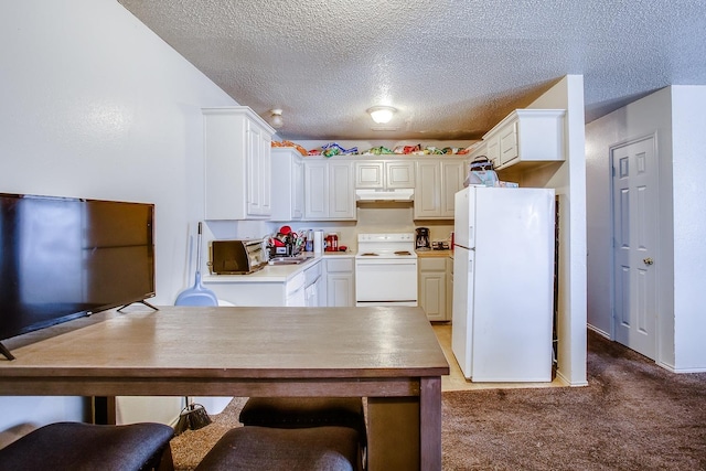 kitchen featuring white cabinetry, carpet floors, and white appliances