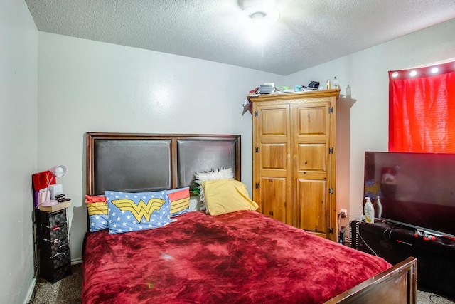 carpeted bedroom with a textured ceiling