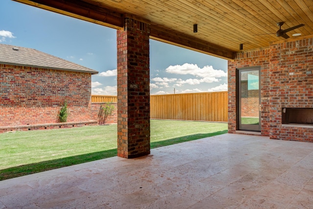 view of patio with a fenced backyard and ceiling fan