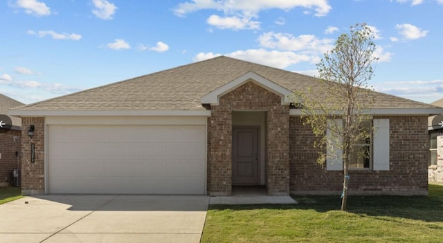 single story home with a garage and a front yard