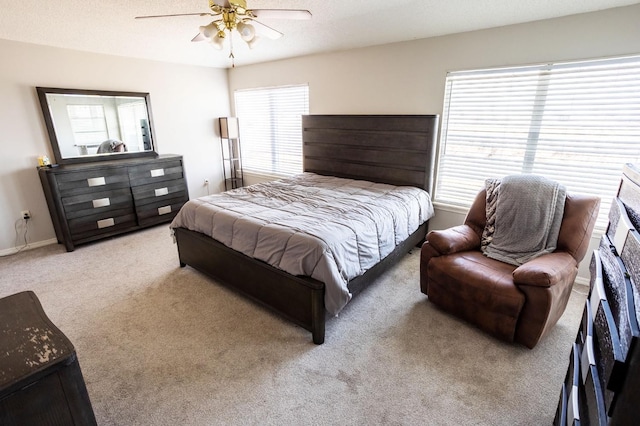 bedroom featuring carpet floors, a textured ceiling, and ceiling fan