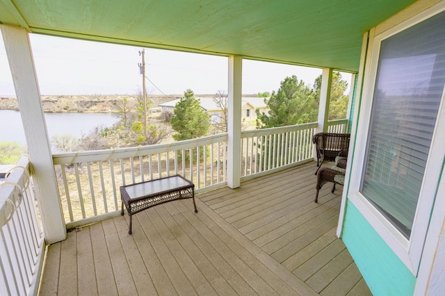 sunroom / solarium with a water view