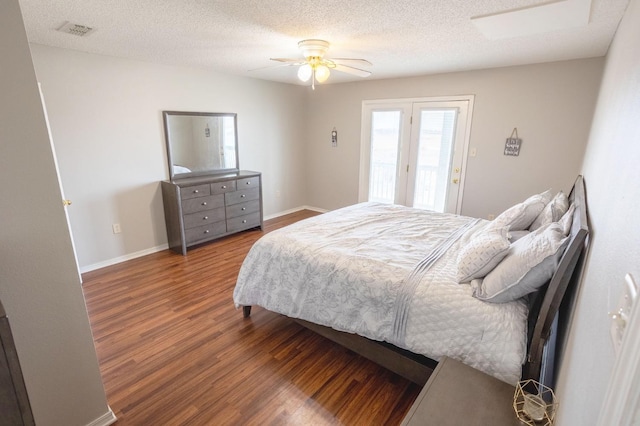 bedroom with wood-type flooring, access to outside, ceiling fan, and a textured ceiling