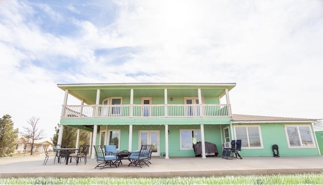 rear view of house featuring a patio