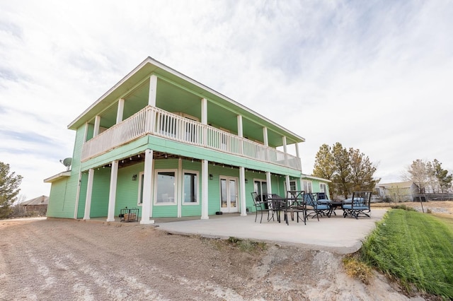 rear view of property featuring a patio