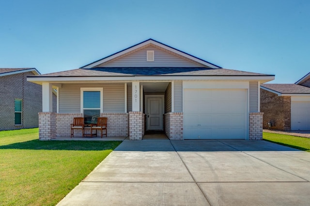 view of front facade with a garage, covered porch, and a front lawn