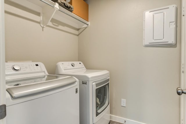 washroom featuring washing machine and dryer